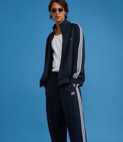 Pantalón Deportiva en Helanca con Rayas Laterales y Estampa Localizada 5