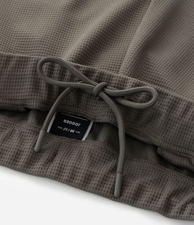 Pantalón Deportivo en Tela Texturizada con Cierre en los Bolsillos 8